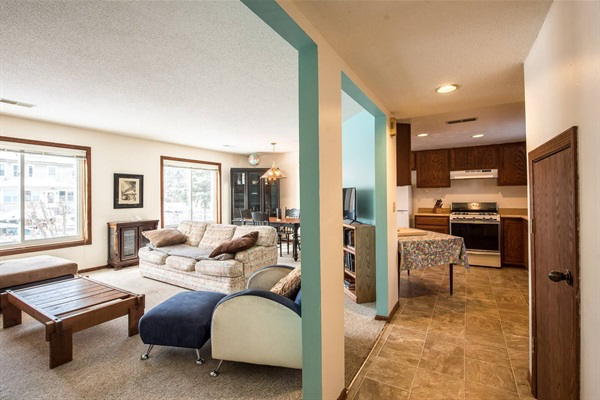 Living room adjacent to dining room and kitchen.