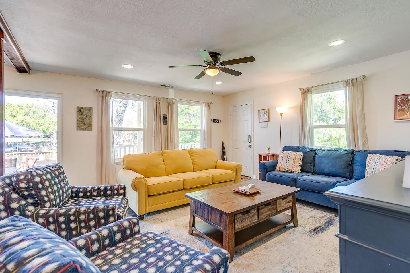 Another view of the open living area with abundant natural light and comfortable gathering space.