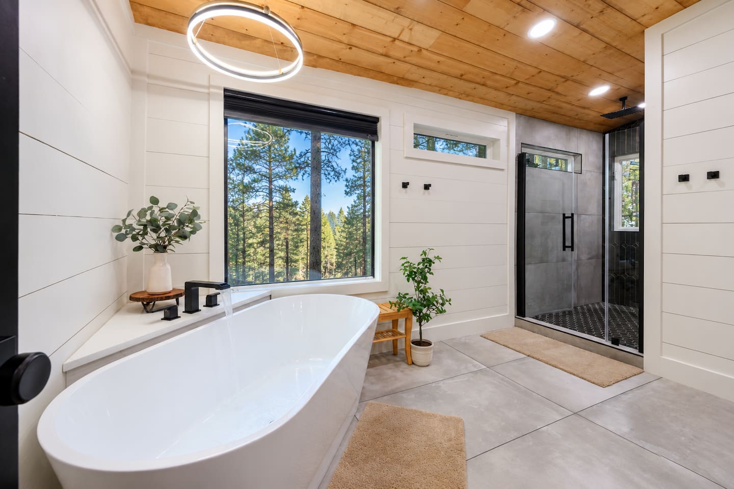 En-suite bathroom with a soaking tub, walk-in shower and double vanity.