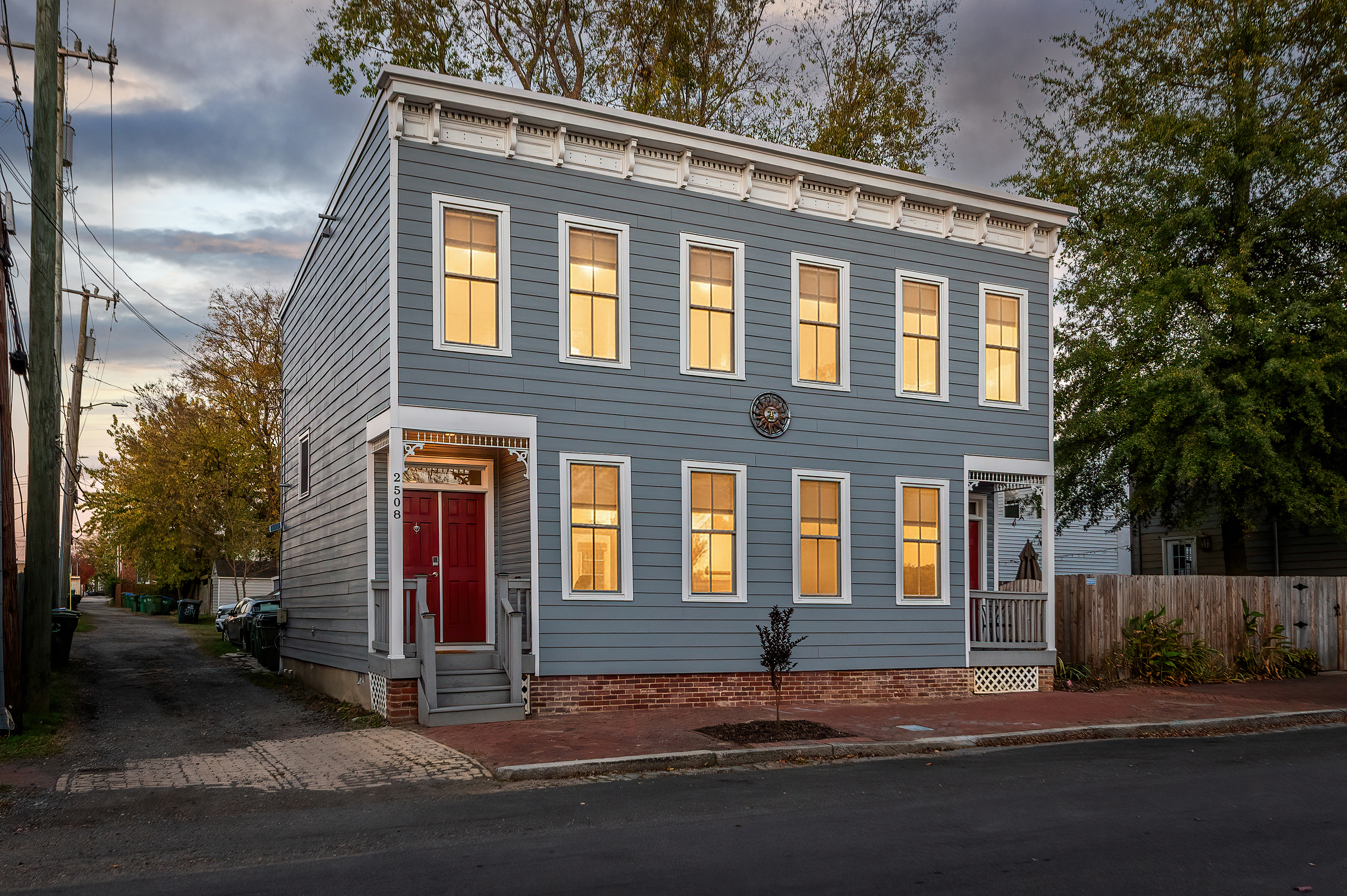 Exterior Escape: Beautifully restored gem with inviting windows and vibrant red door!