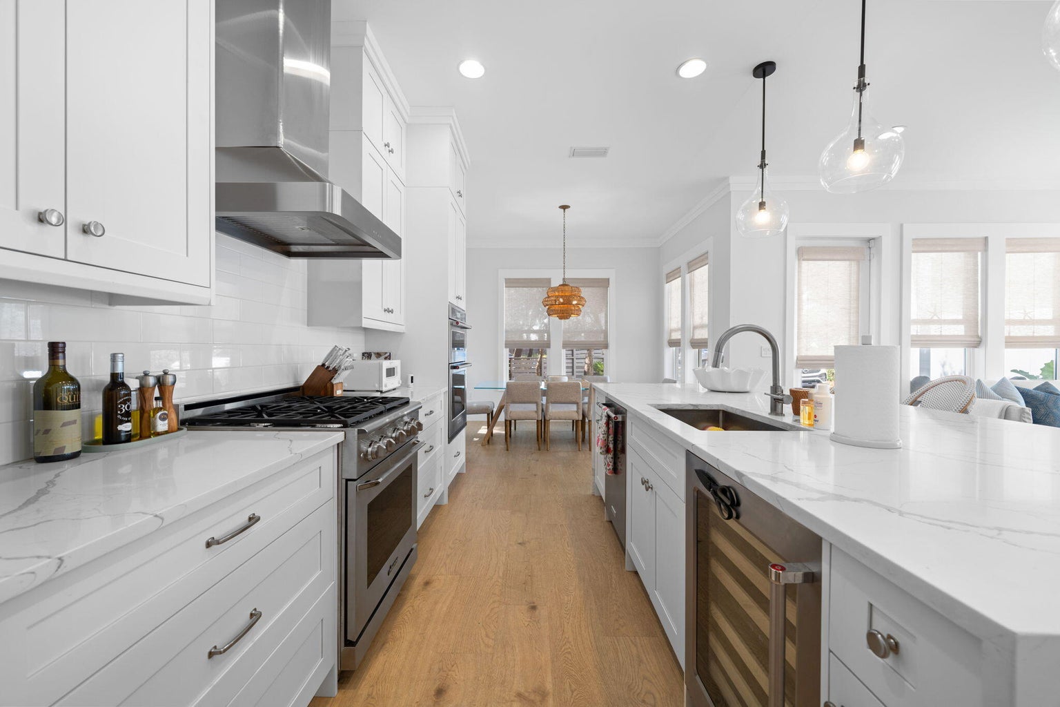 Kitchen offers a gas range, wine cooler, a fridge/freezer, built in microwave and oven.