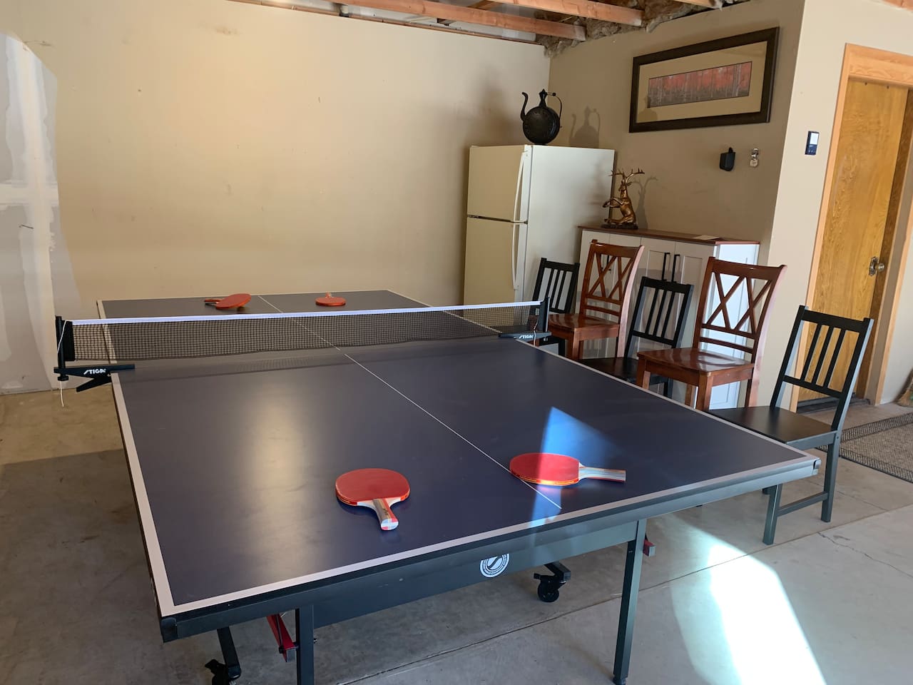 Bring your competitive side for some ping pong! An outdoor fridge provides plenty of space for your drinks. 