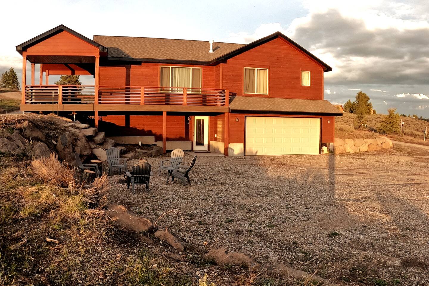 Walk out basement, upper level deck overview with hot tub, firepit and garage