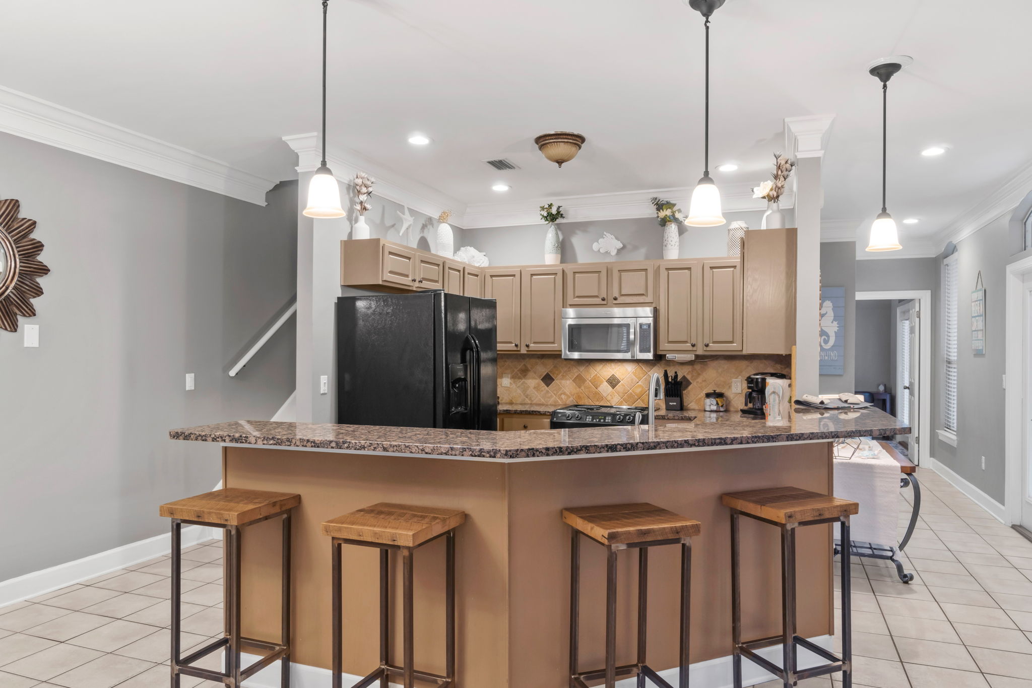 Kitchen with bar stools for additional seating