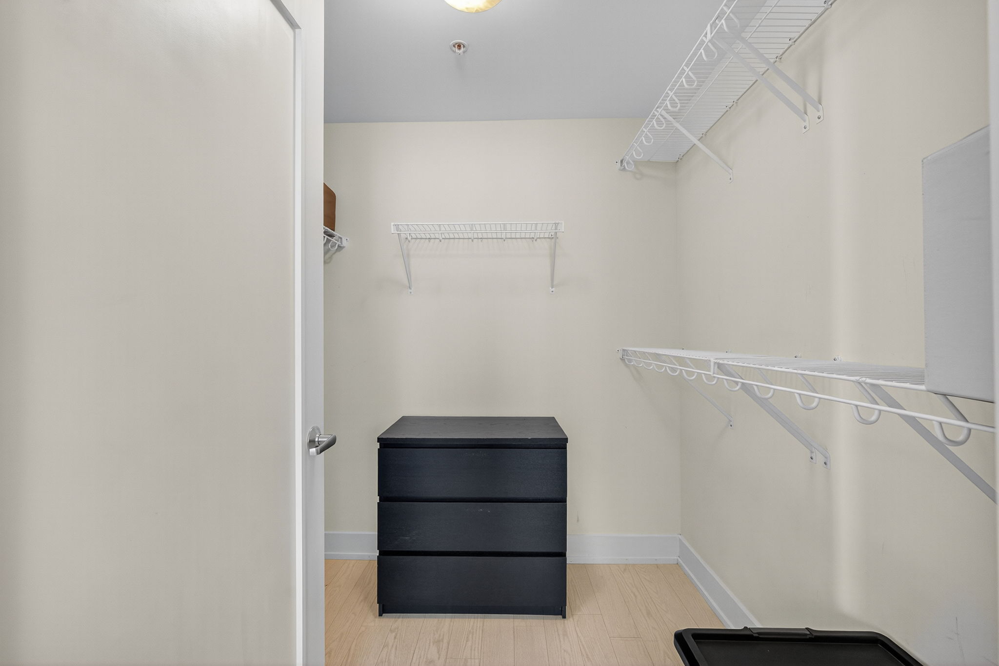 Plenty of storage space in the walk-in closet—includes shelving, storage bins, a full-length mirror, and hangers to keep your wardrobe organized.