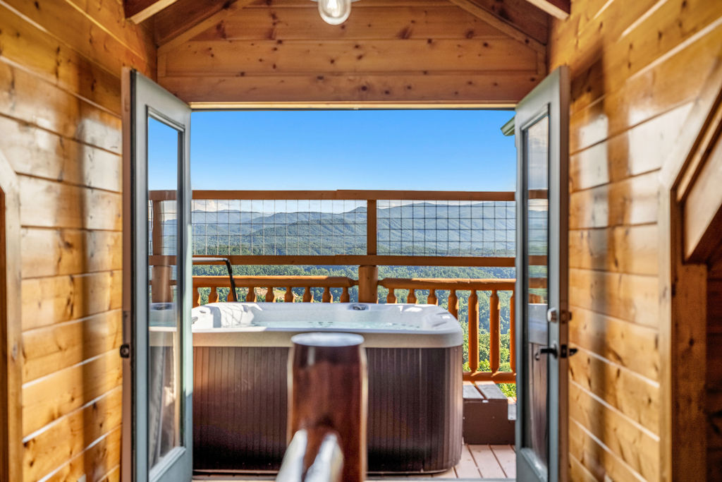 Unwind under the stars in a 6-person hot tub with panoramic mountain views.