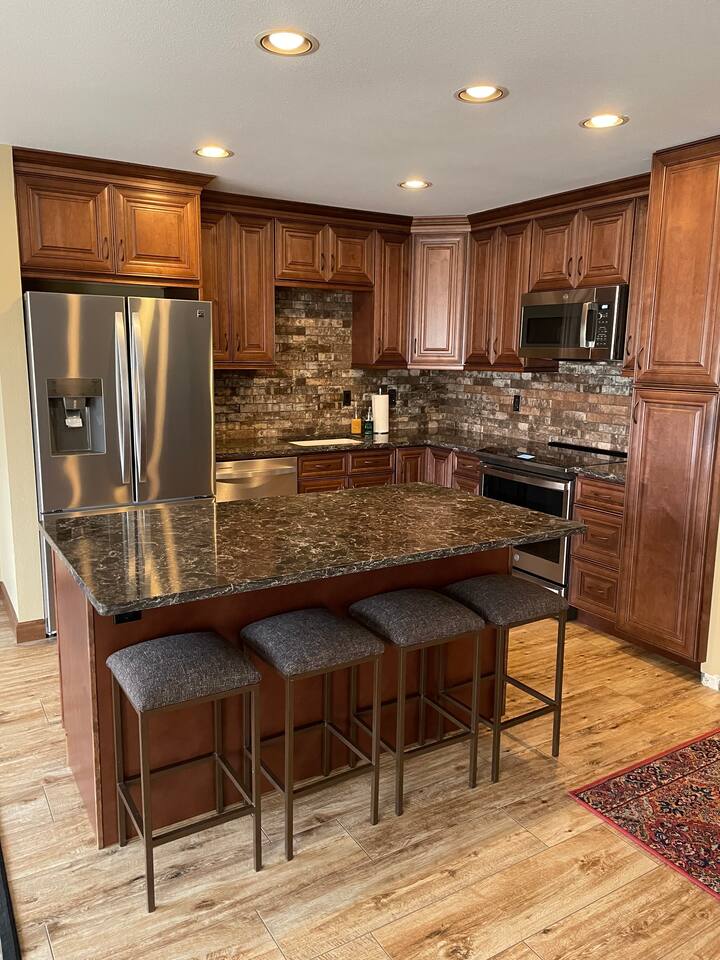 Kitchen with quartz counter tops and an induction range