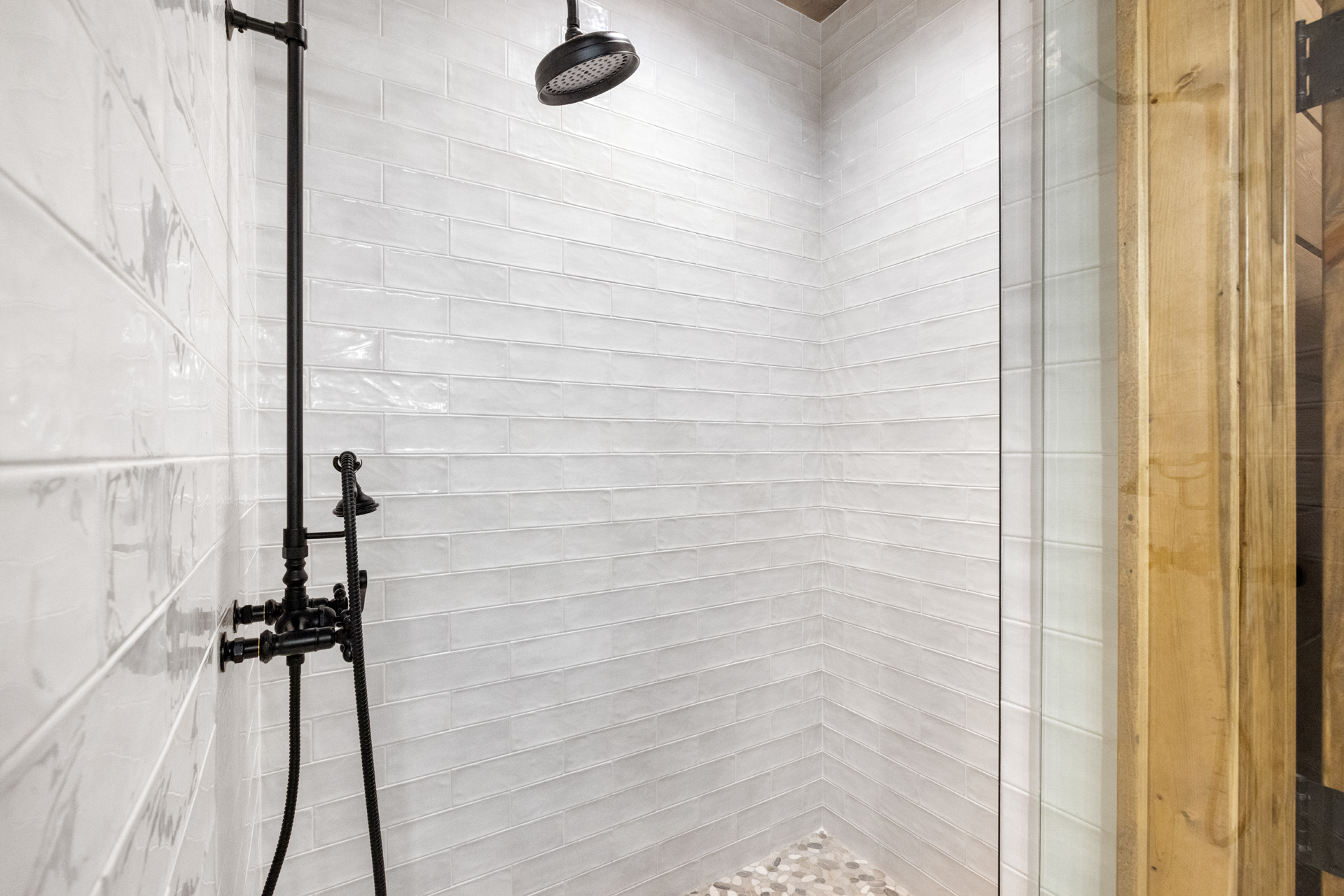 Walk-in shower with sleek tilework and modern rustic style