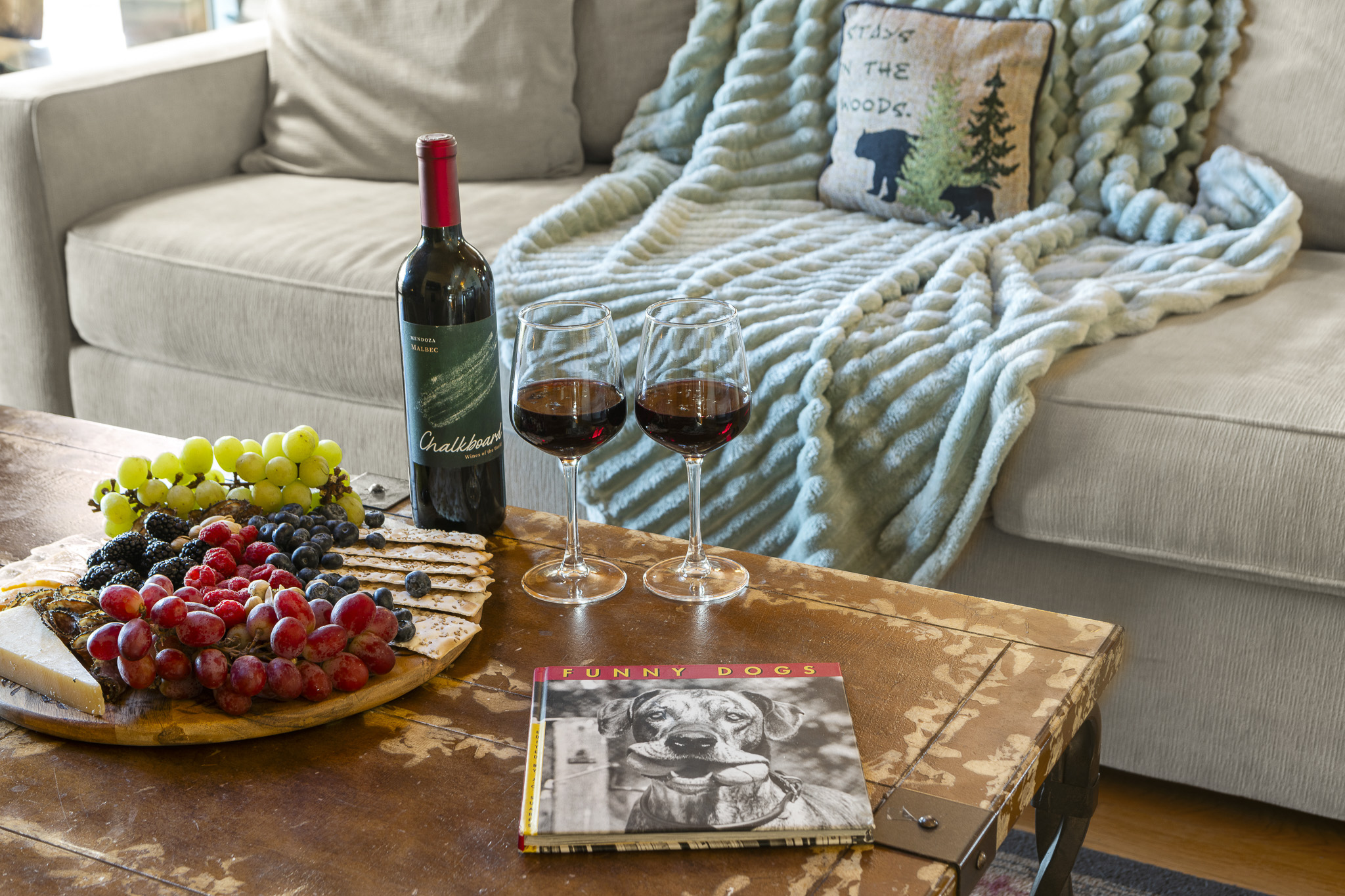 Living Room Retreat: Savor wine and snacks in this inviting space, perfect for laughter and relaxation!