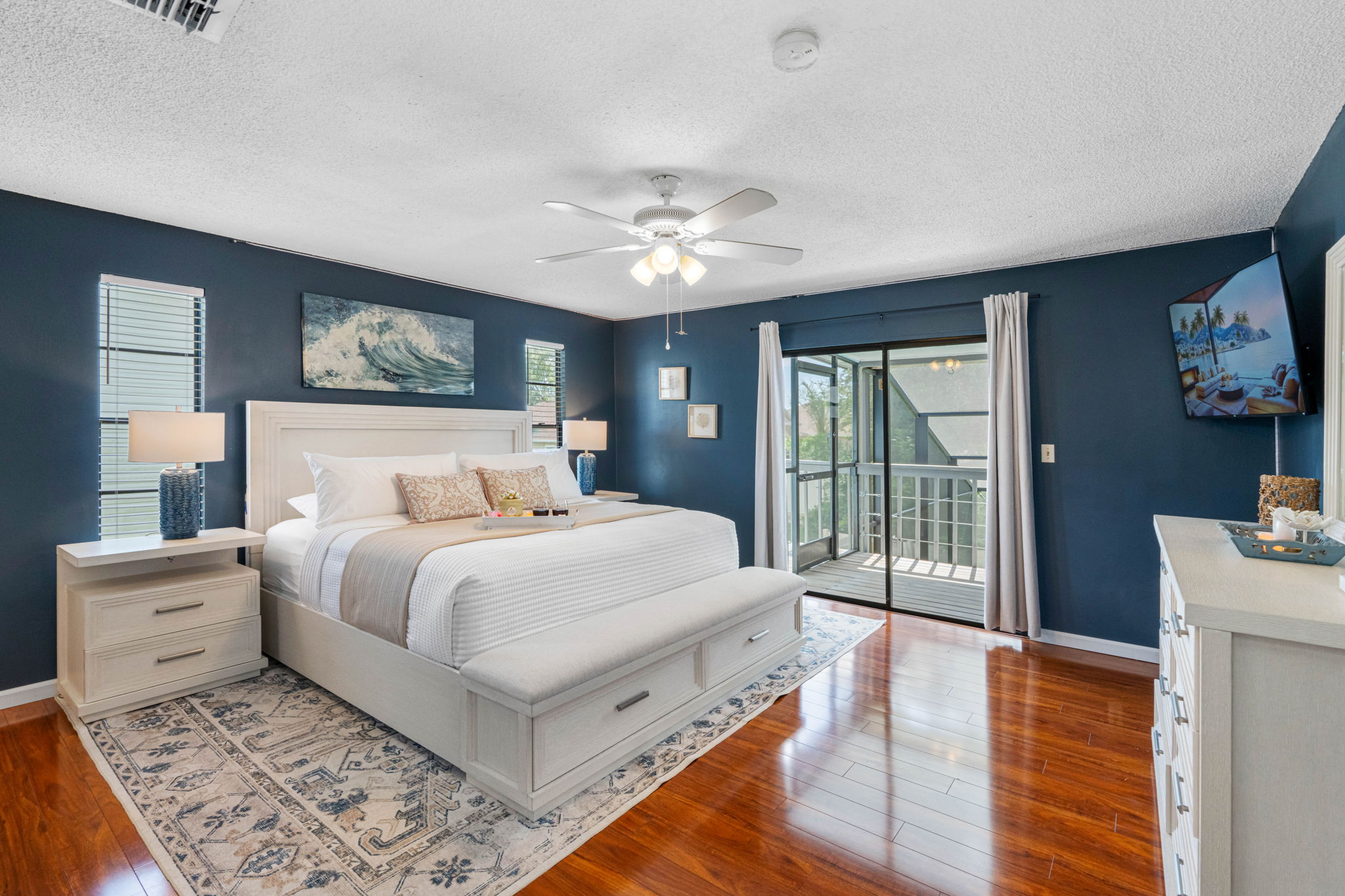 Twin windows frame each side of the bed, letting in natural light while maintaining privacy.