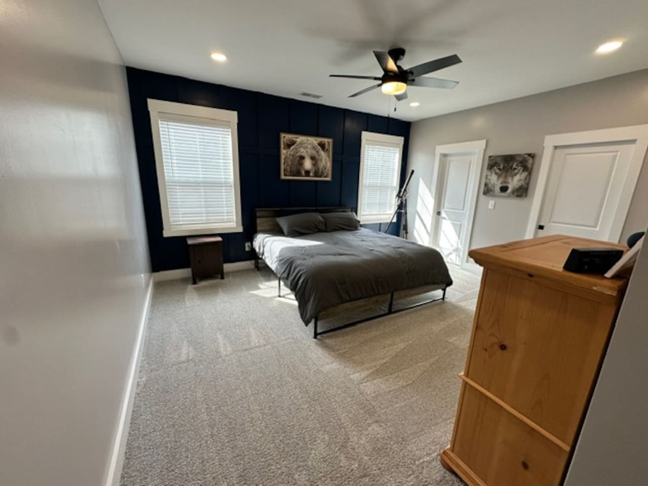 Large bedroom with private sink and shared access to private shower/toilet rooms with bedroom #2. Quaint under stair nook on opposite wall. 