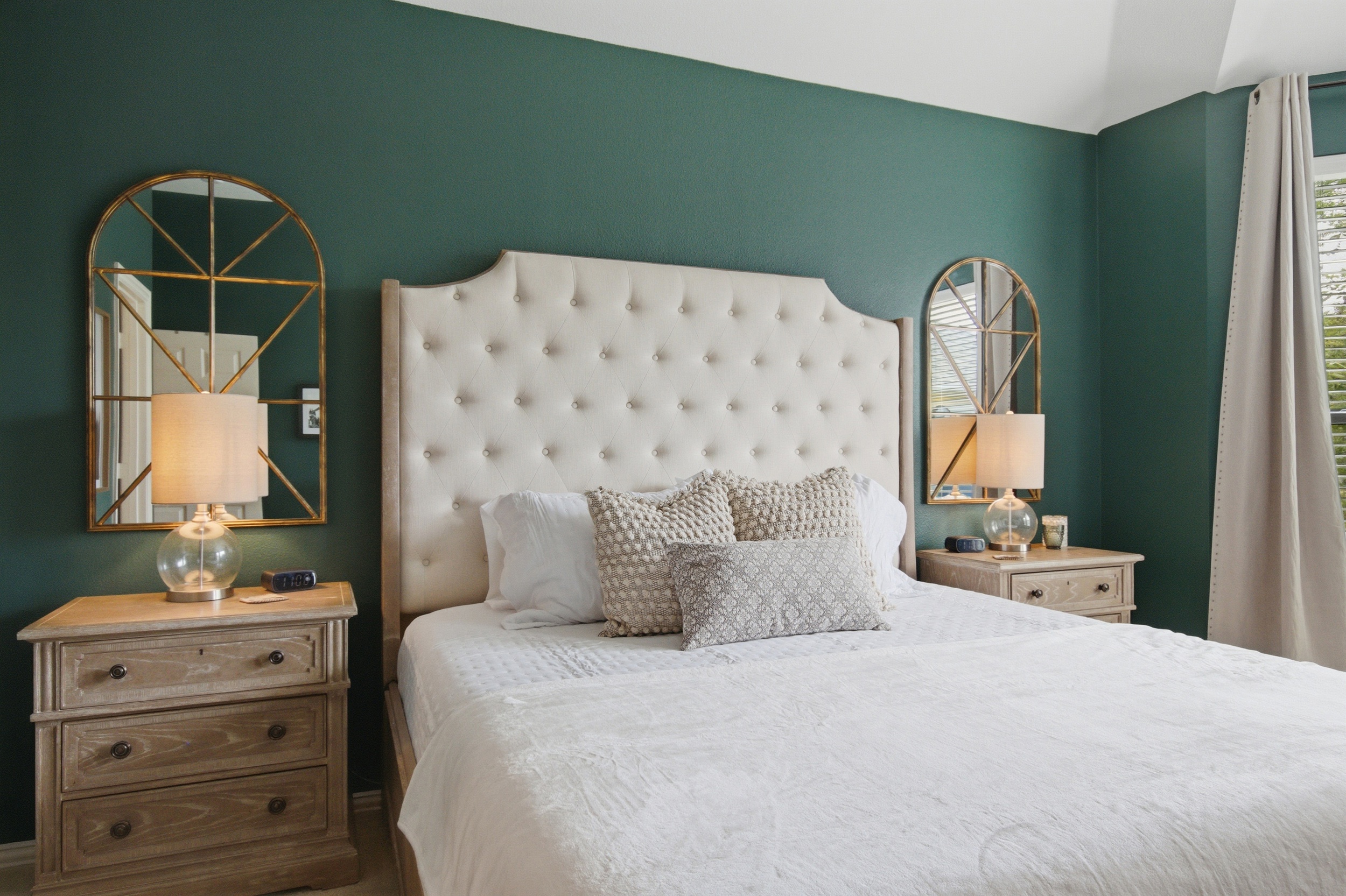 Plush King Bed in the Master Bedroom, dressed in crisp linens, soft pillows, and warm lamplight for relaxed evenings.
