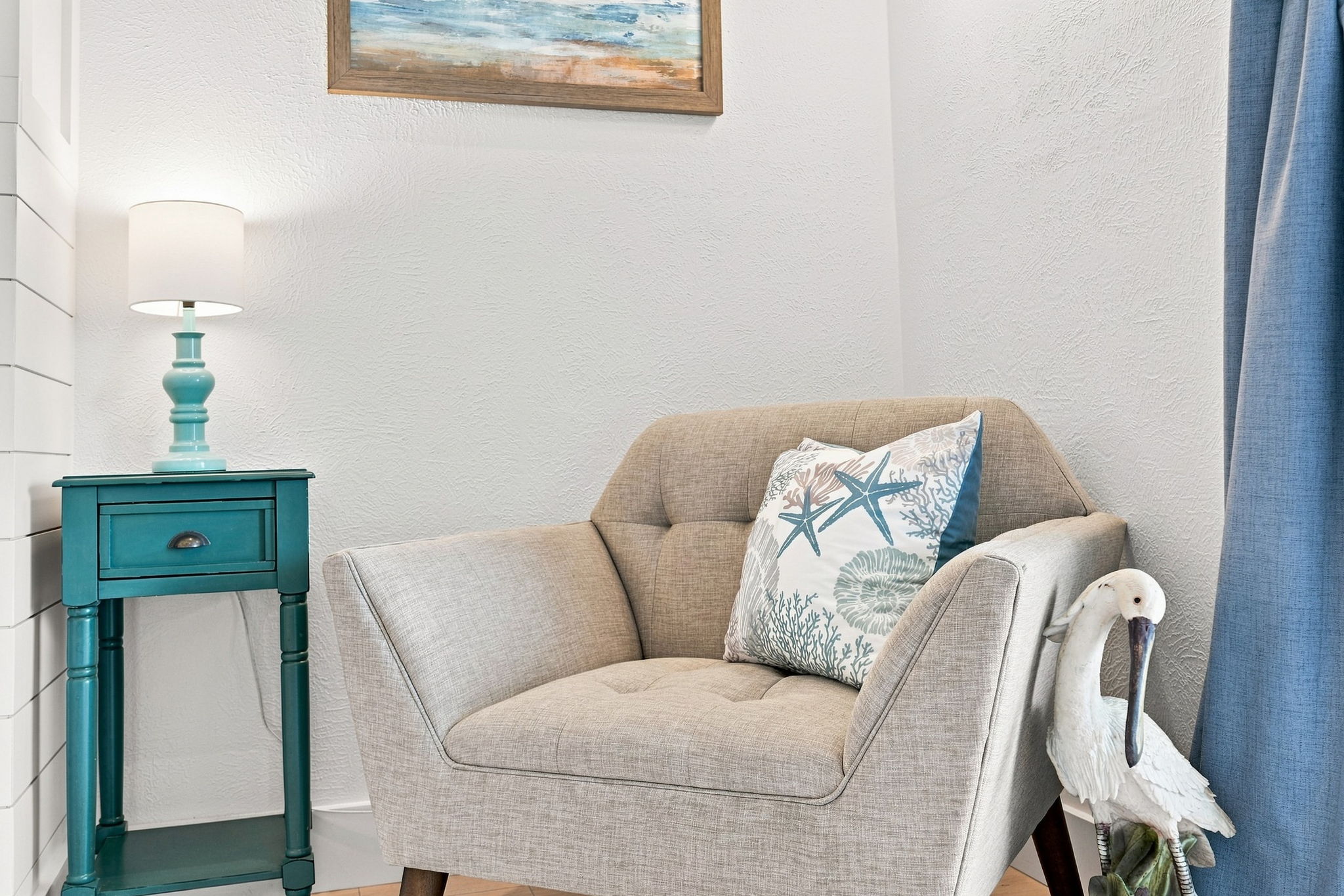 A cozy little corner designed for quiet mornings, good books, and taking in the coastal calm.