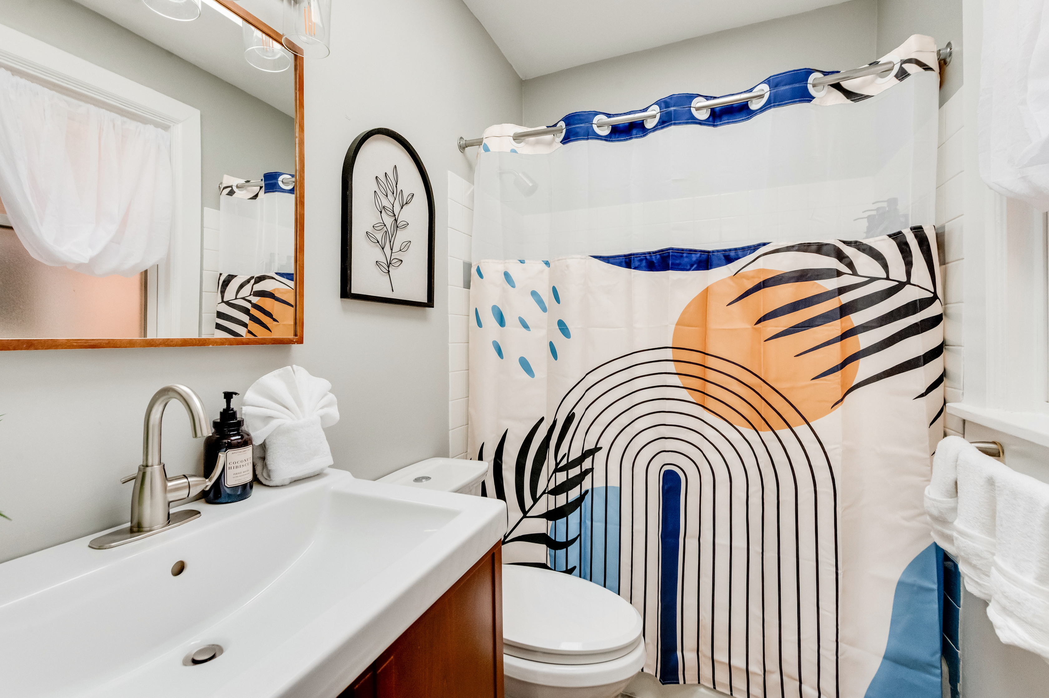 Bath Oasis: Vibrant decor and modern fixtures create the perfect refreshment retreat!