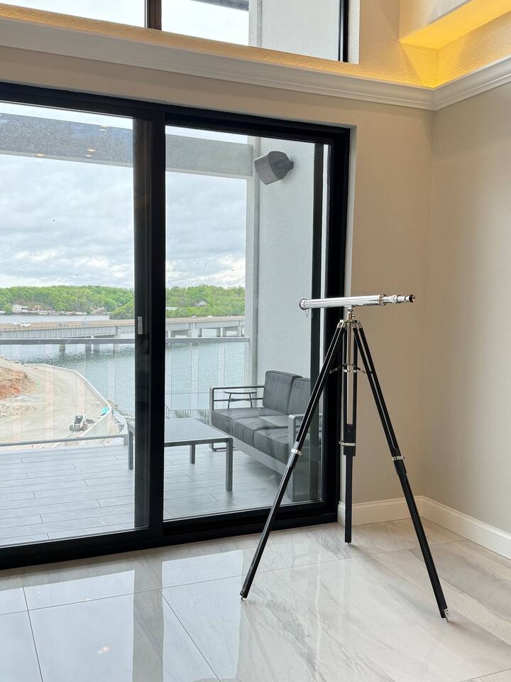 Floor to ceiling windows and sliders. Vaulted ceiling with skylights which create grand open spaces. 