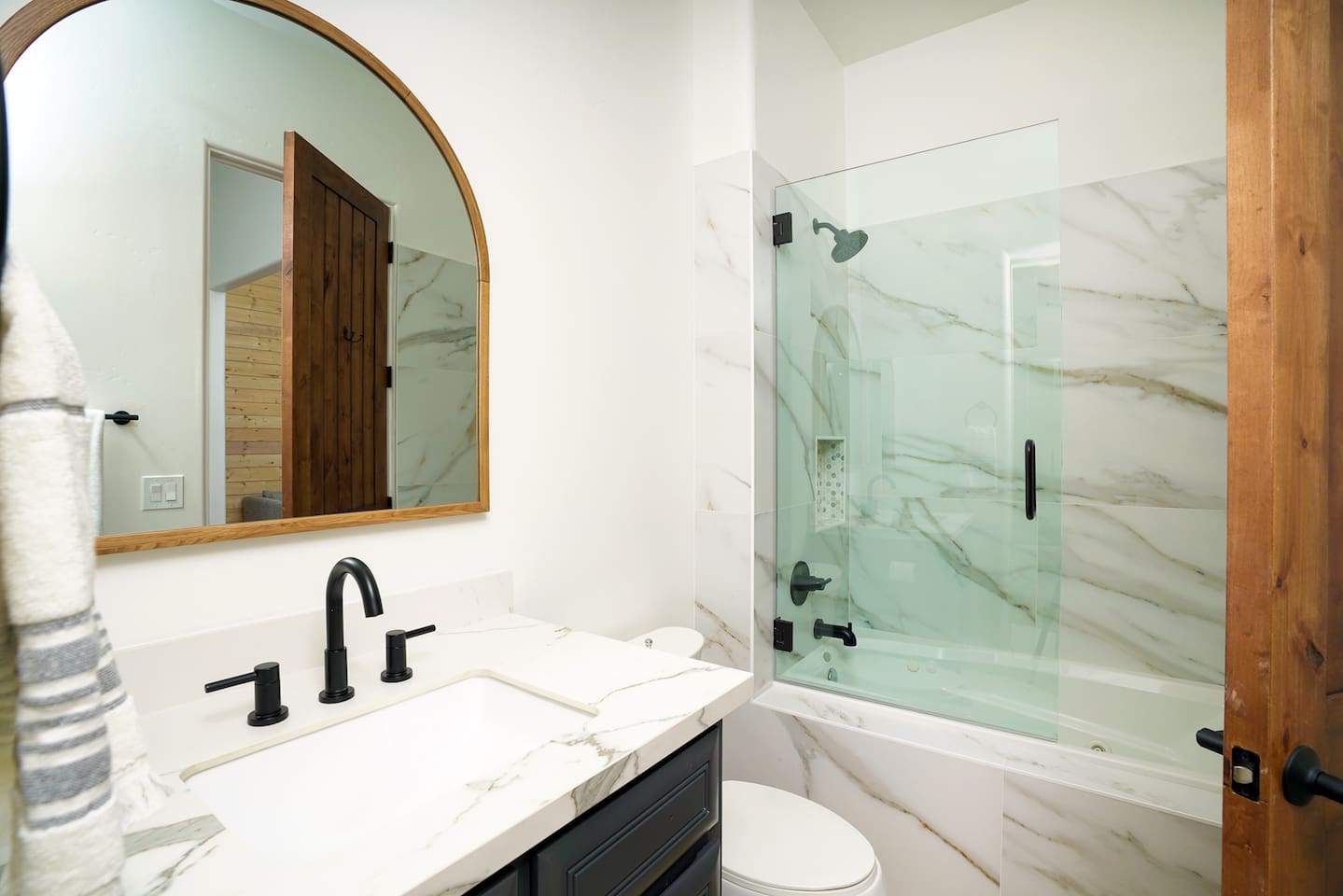 Private bathrooms in each bedroom, this one with a jet-tub / shower combination.
