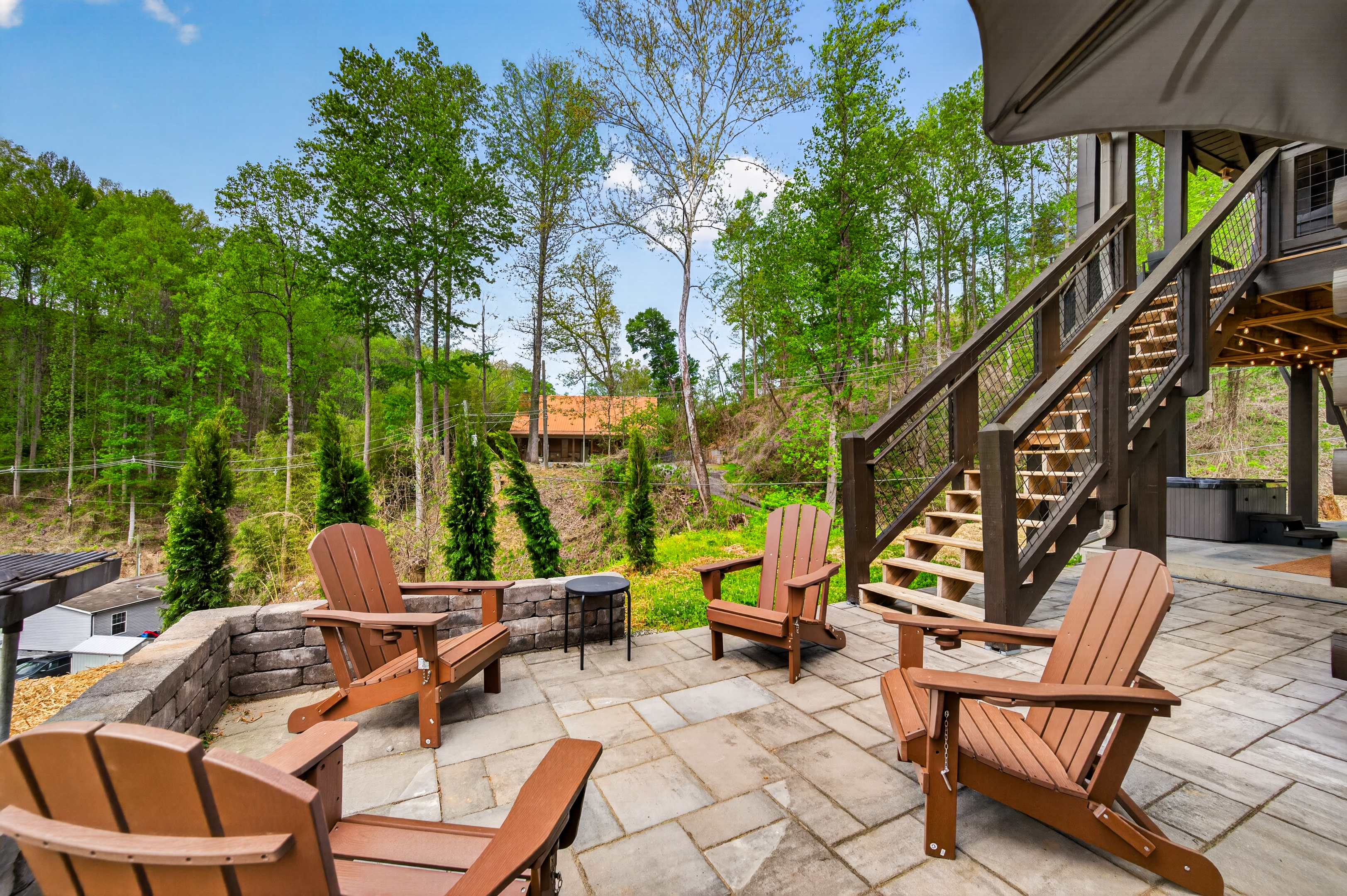 Outdoor seating area with charcoal grill.