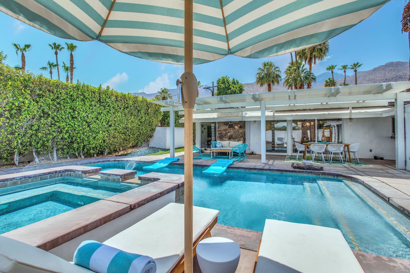 Private secluded pool with mountain and palm tree views