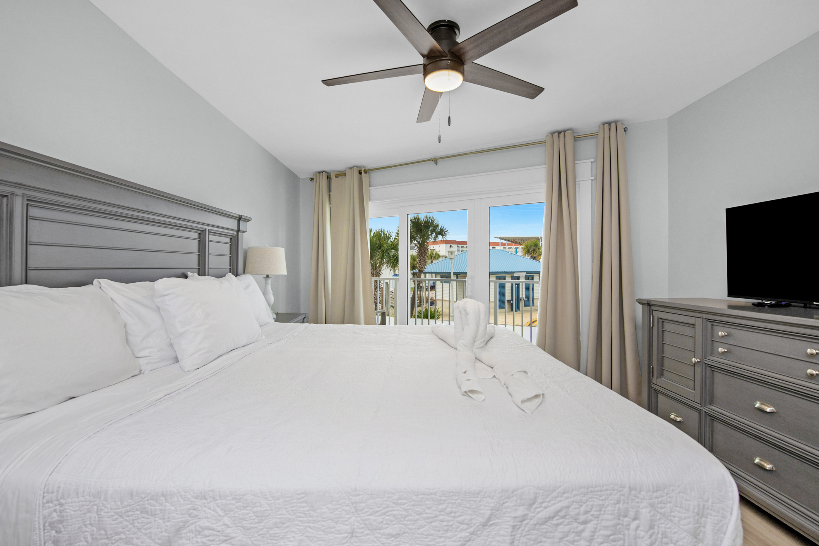 King sized bed and access to the balcony. 