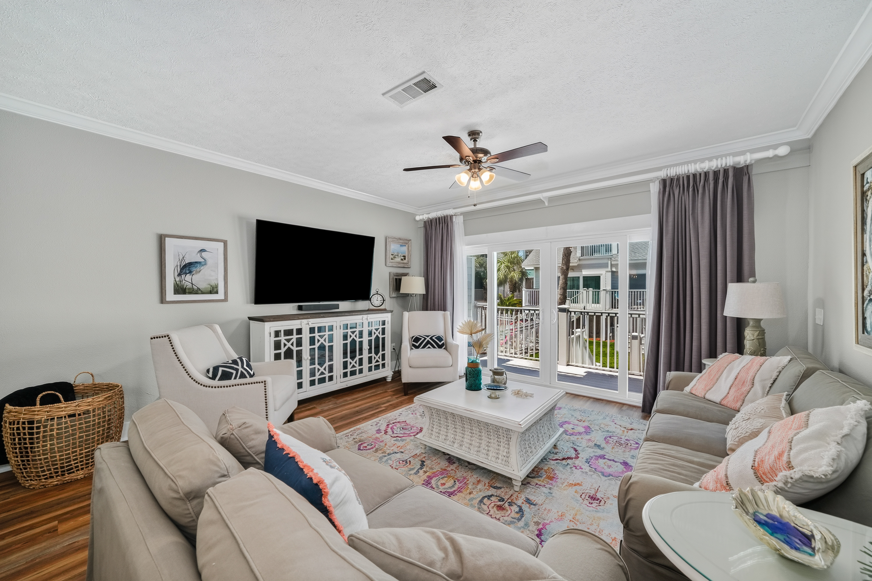 Spacious living room with Smart TV, comfortable seating, and an open-concept layout.