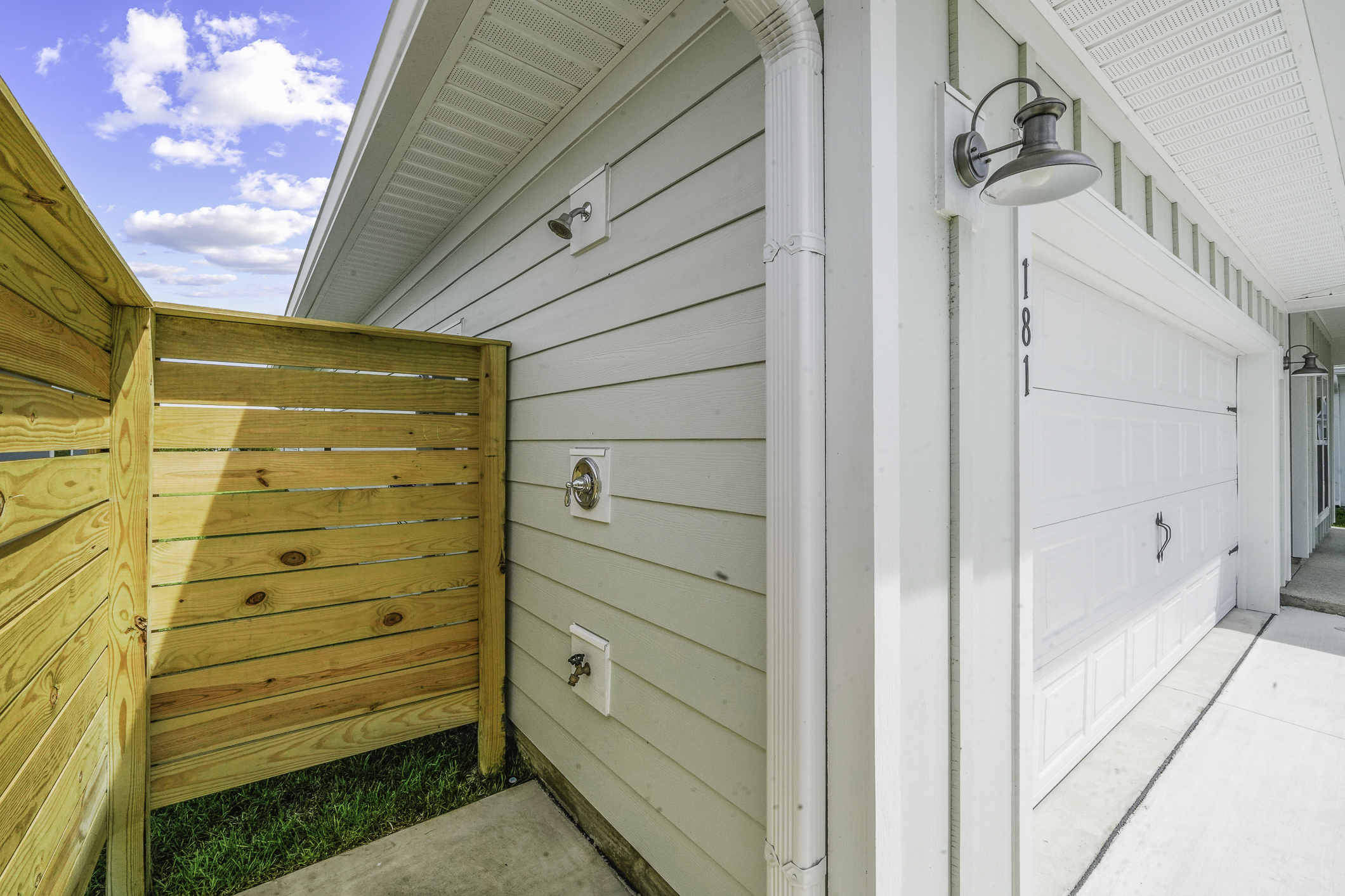 Outdoor shower available to rinse off sand before heading inside.