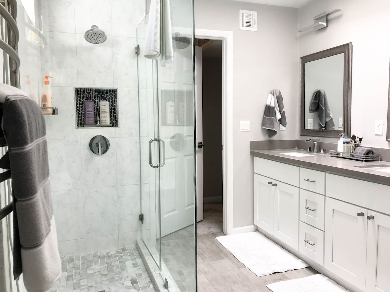 Two sinks and large shower. Plenty of walk around room