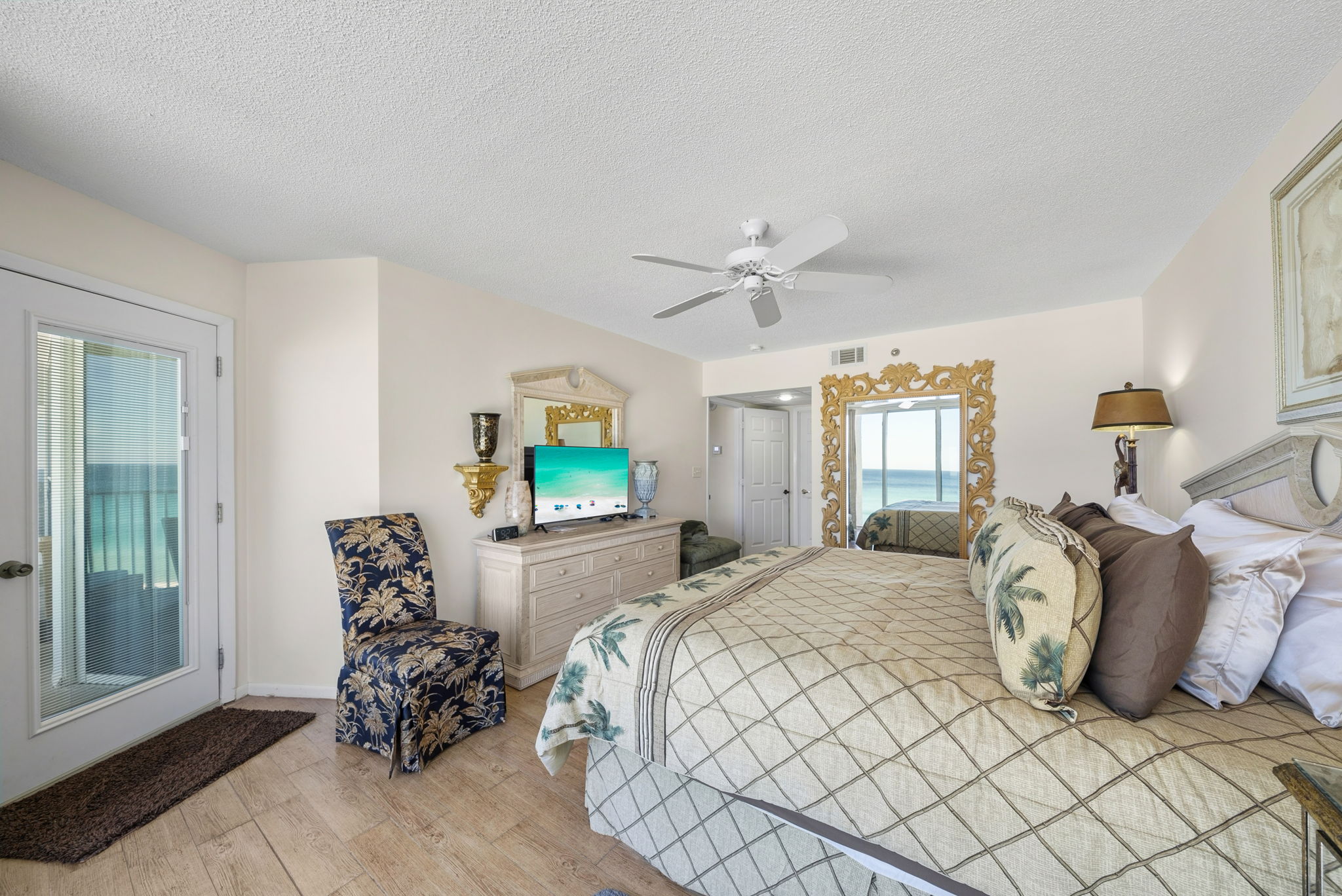 Master king suite with floor to ceiling window views of the beach, private balcony access and en-suite bathroom