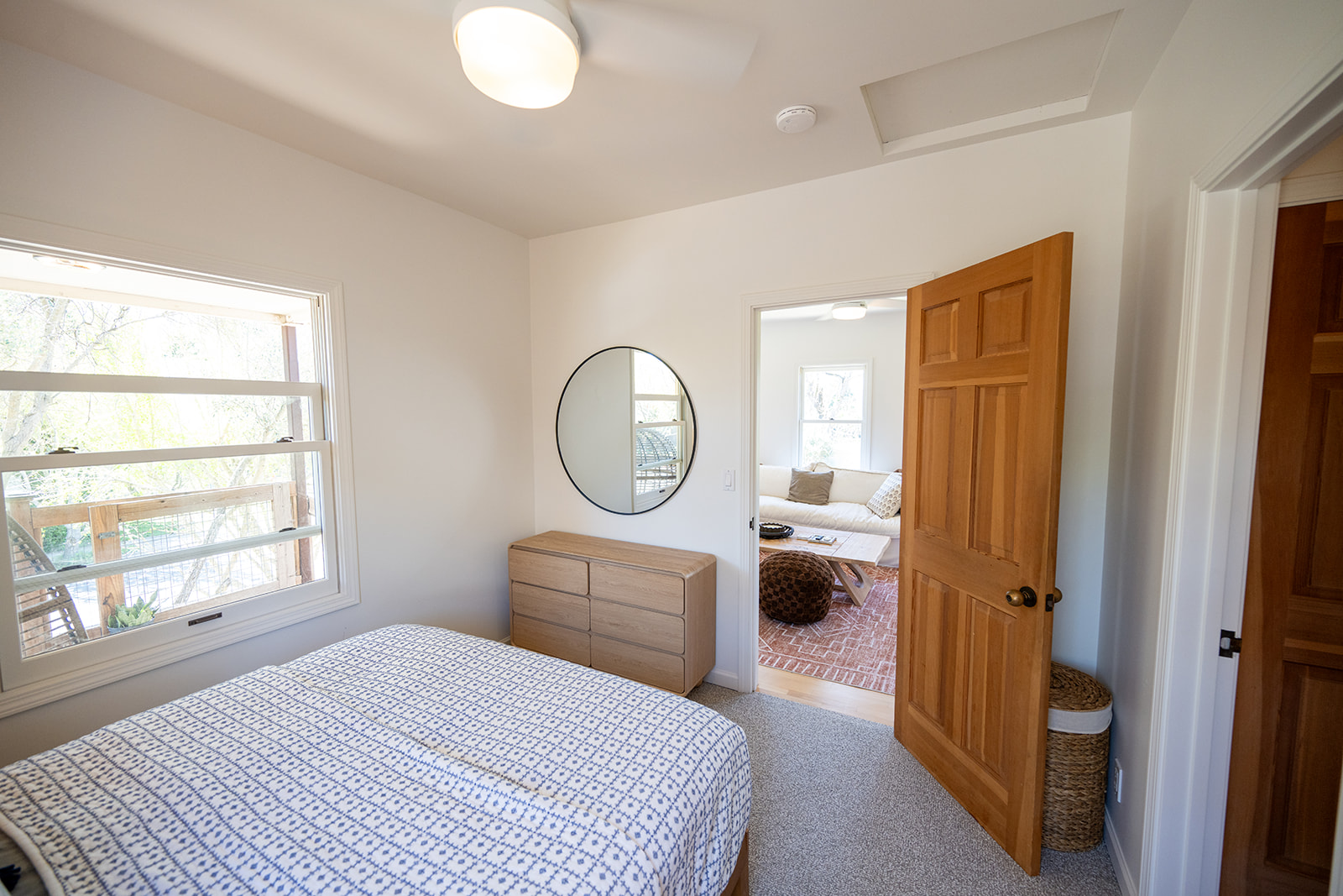 Comfortable bedroom featuring a queen bed, soft linens, and a calm setting for a restful night’s sleep