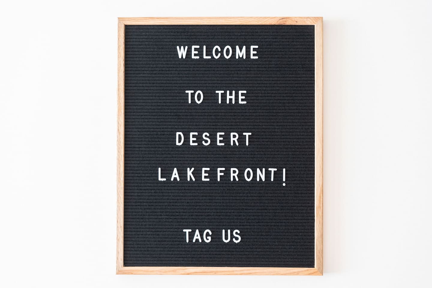 Welcome sign with a warm greeting to the Desert Lakefront — a personal touch that makes guests feel right at home.