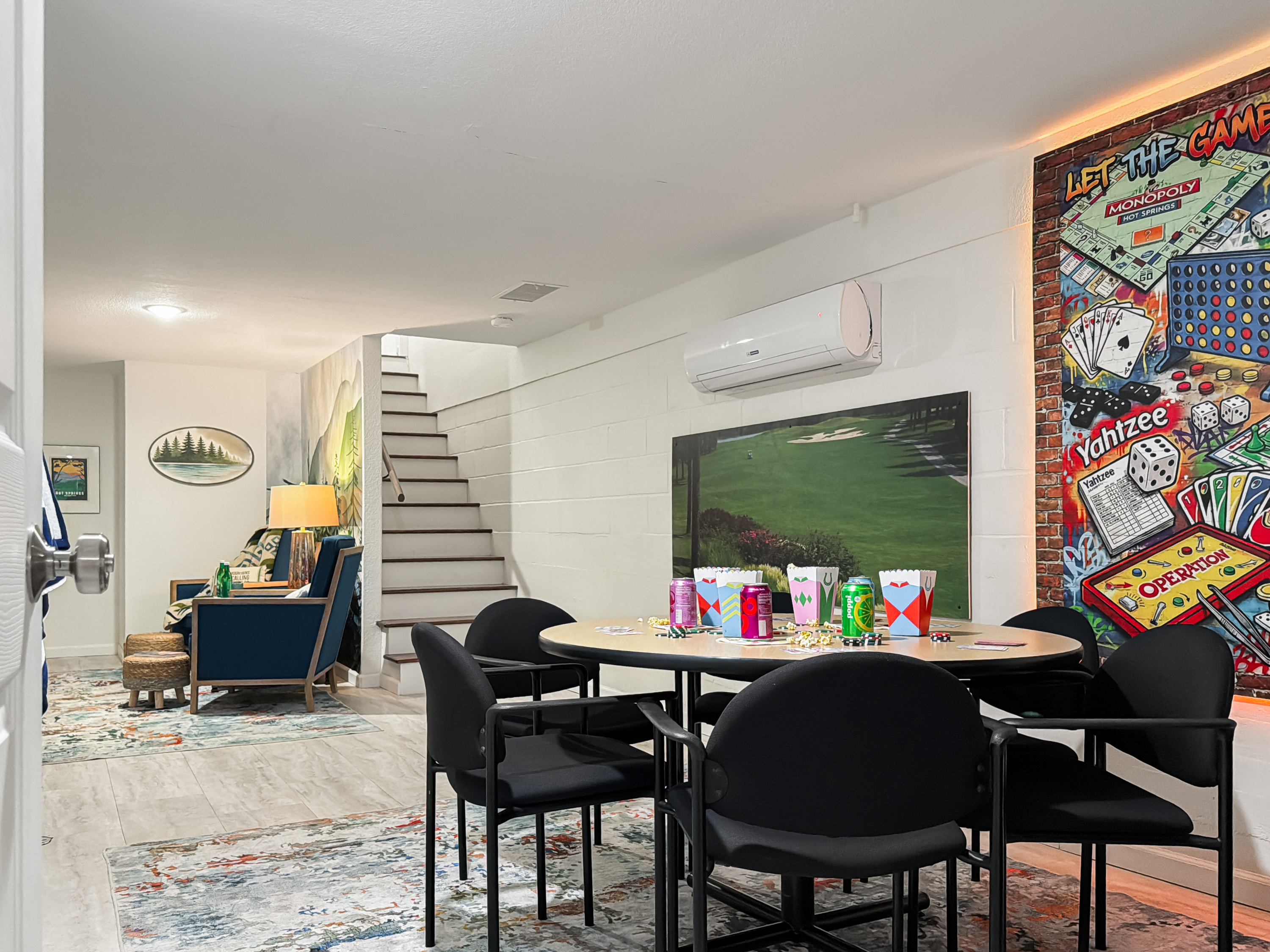 Head downstairs to the game room — cards, classic board games and movie nights that keep the crew busy long after the track closes.