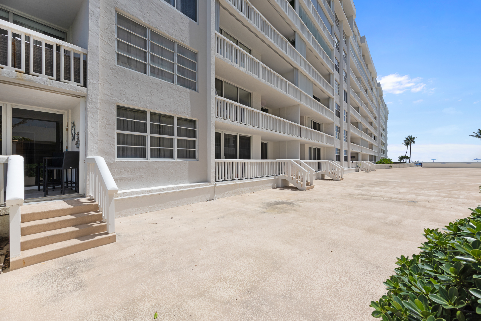 Six units in the building have this. You're in one of them. Walk straight out to the pool and beach — no elevator, no street crossing.