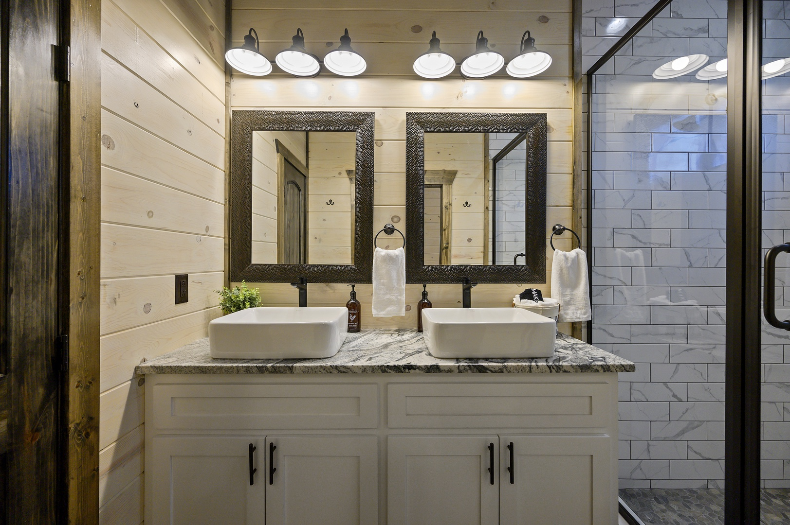Modern double vanities and elegant finishes bring a spa-like ease to every routine.
