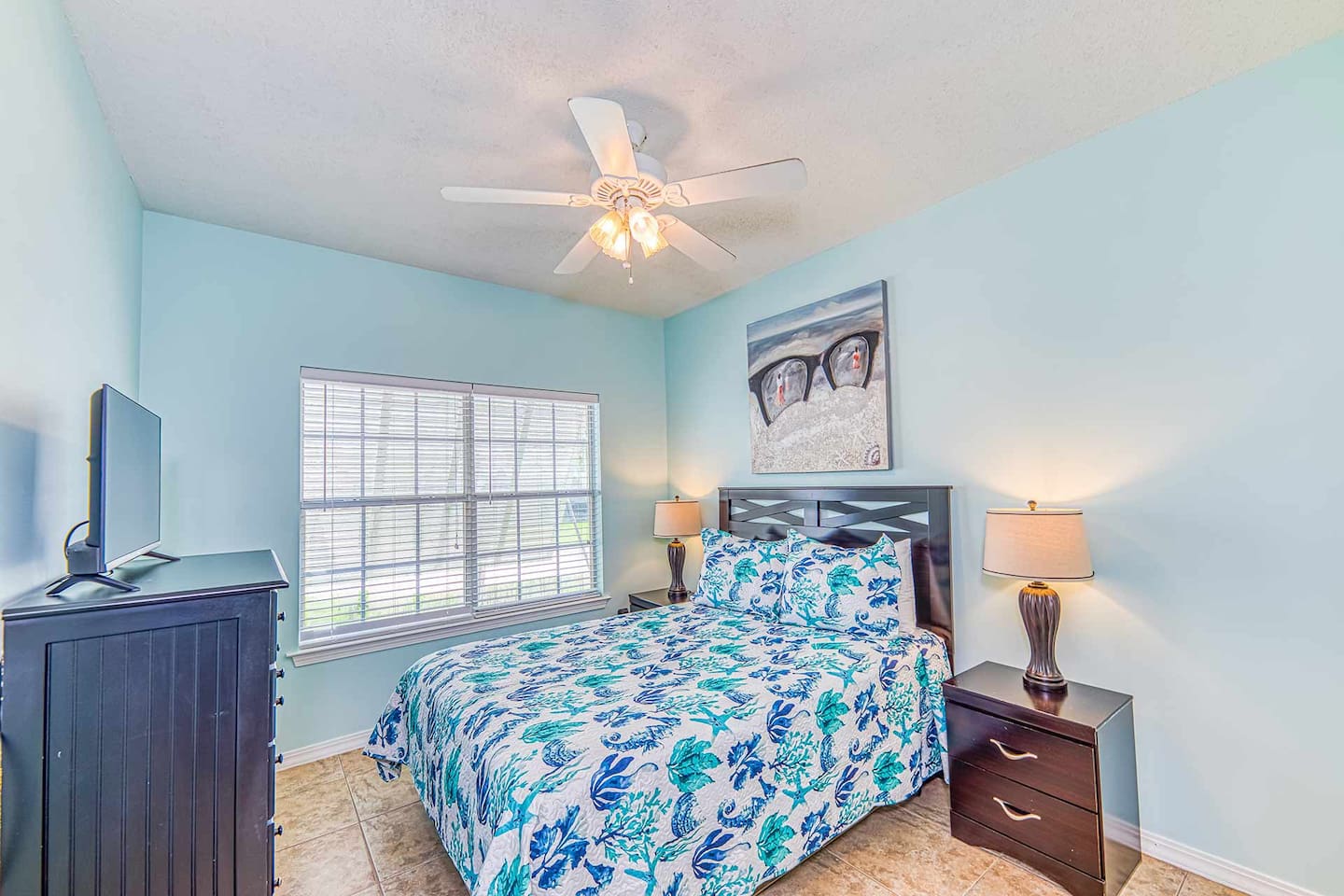 Bedroom Retreat: Bright and airy oasis with beachy decor, perfect for a restful getaway!