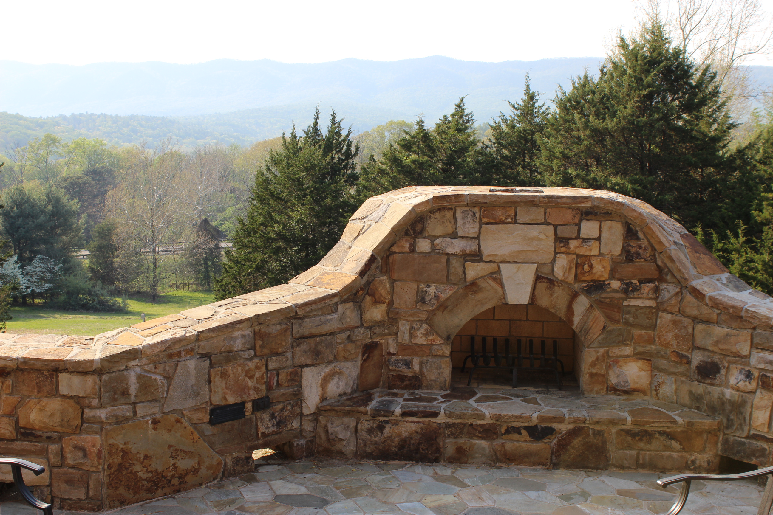 Fire pit on the patio surrounded by gorgeous mountain views.