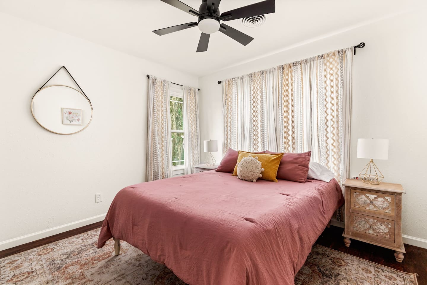 Lovely décor in this spacious bedroom.

Wall-mounted power strips provide ample space to charge any devices you may have on hand.