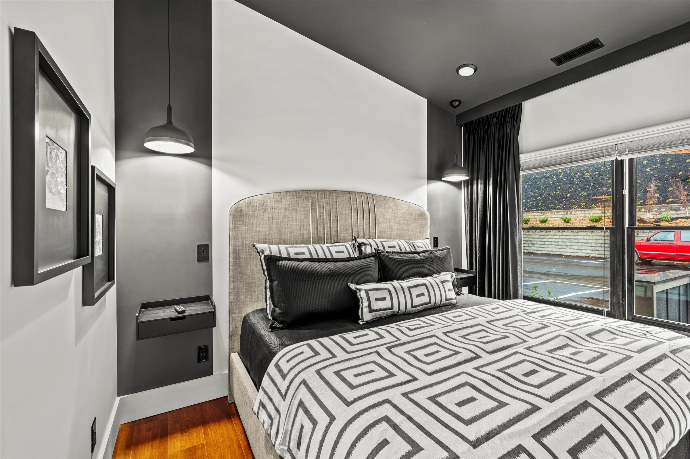 Sink into a premium King-sized bed, featuring high-end comfort and designer bedding specifically curated for your most restful night yet.