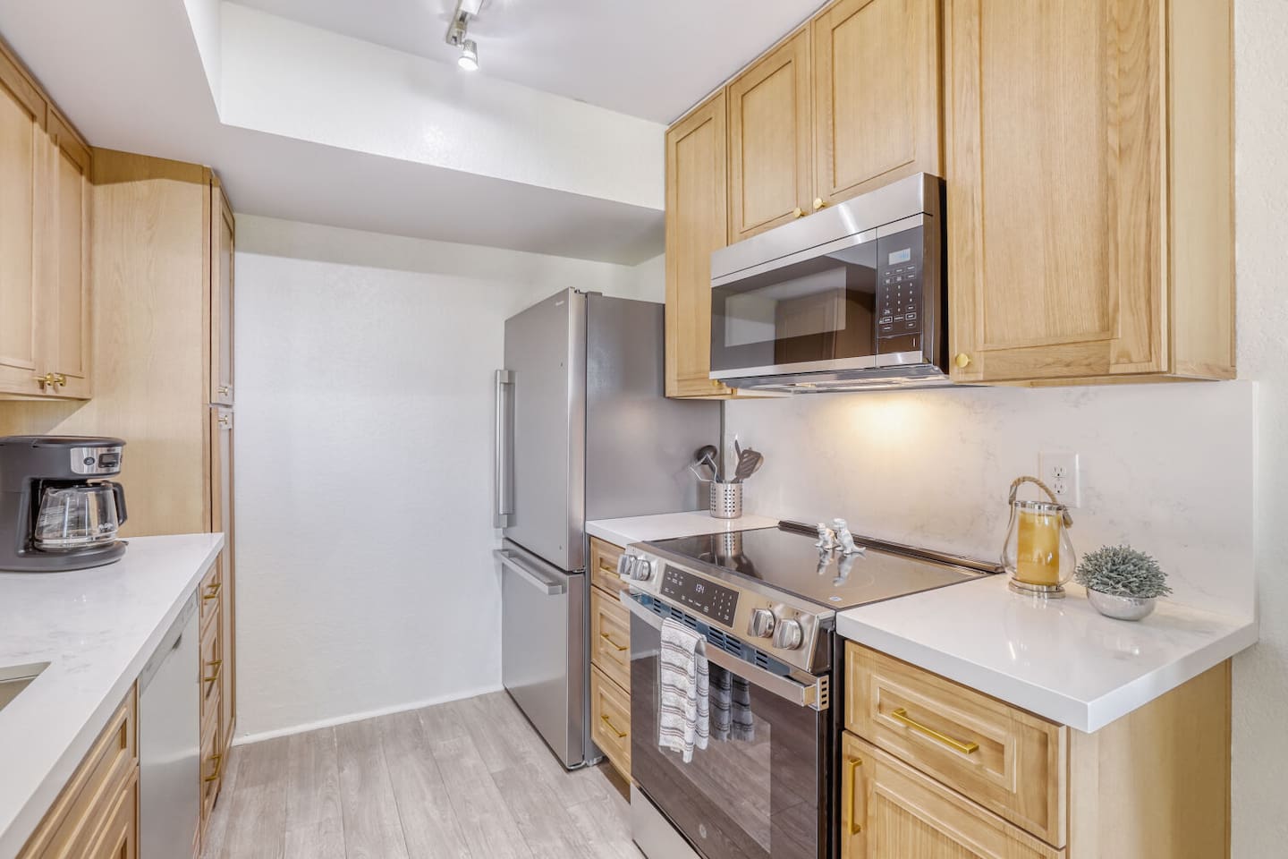 Stainless steel appliances and quartz counters make whipping up breakfast before a big day feel effortless.