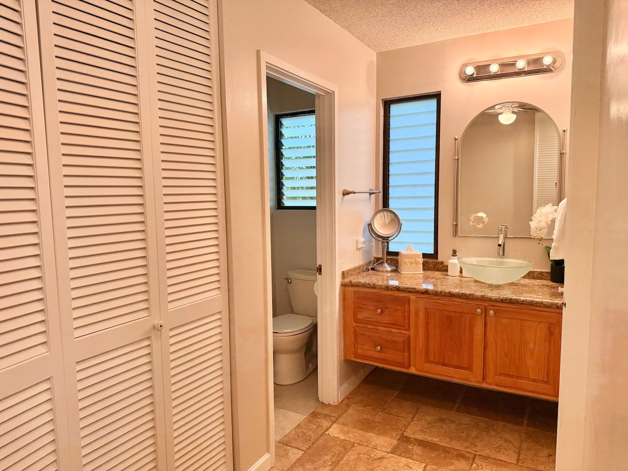 Main Bathroom - features a walk-in shower, vanity, fresh towels and extra storage for your convenience