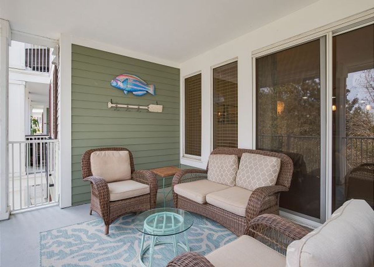 Balcony wicker seating beside the sliding doors from the living room