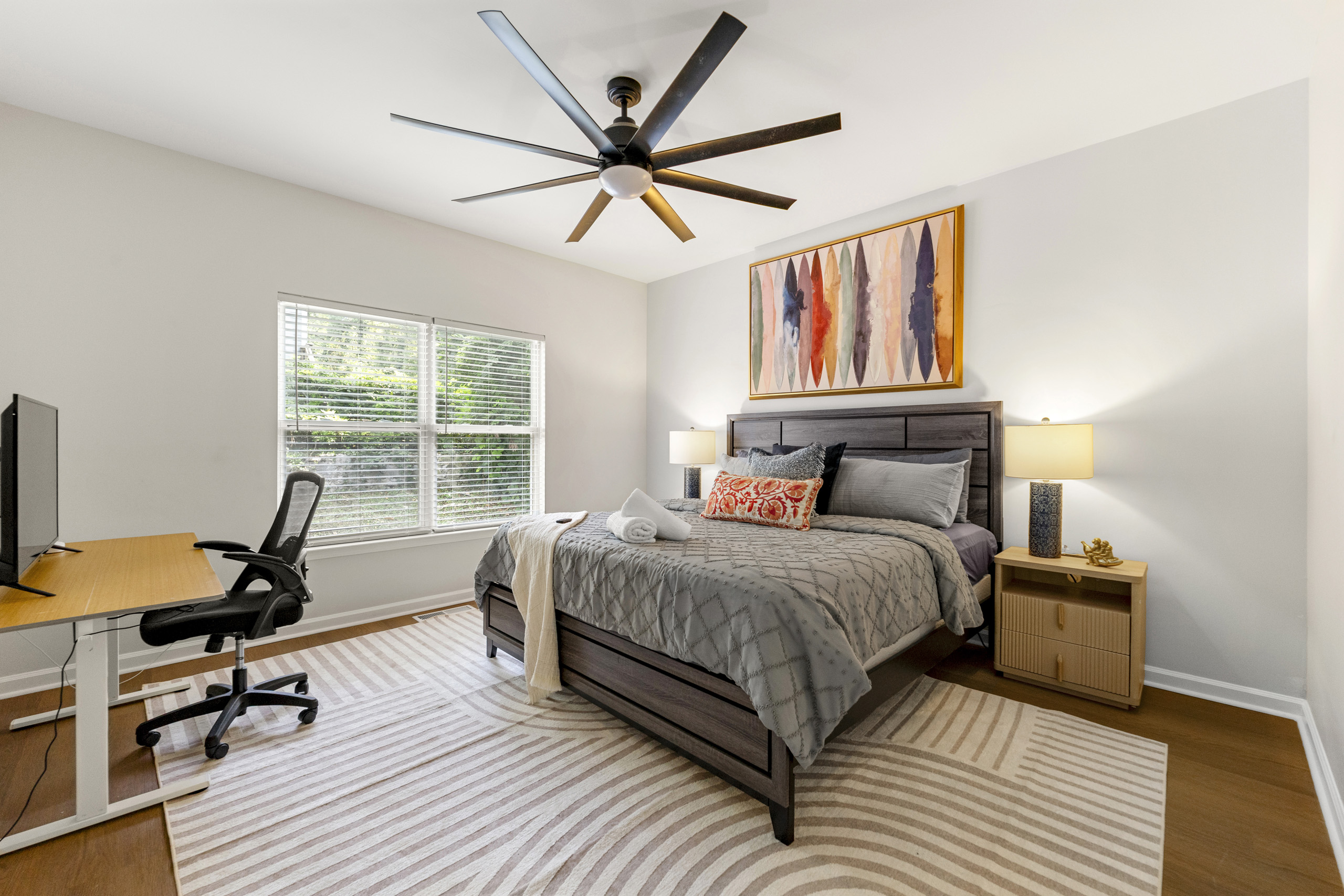 There's multiple king beds available for you! This one is on the 1st floor with it's own bathroom and workspace!