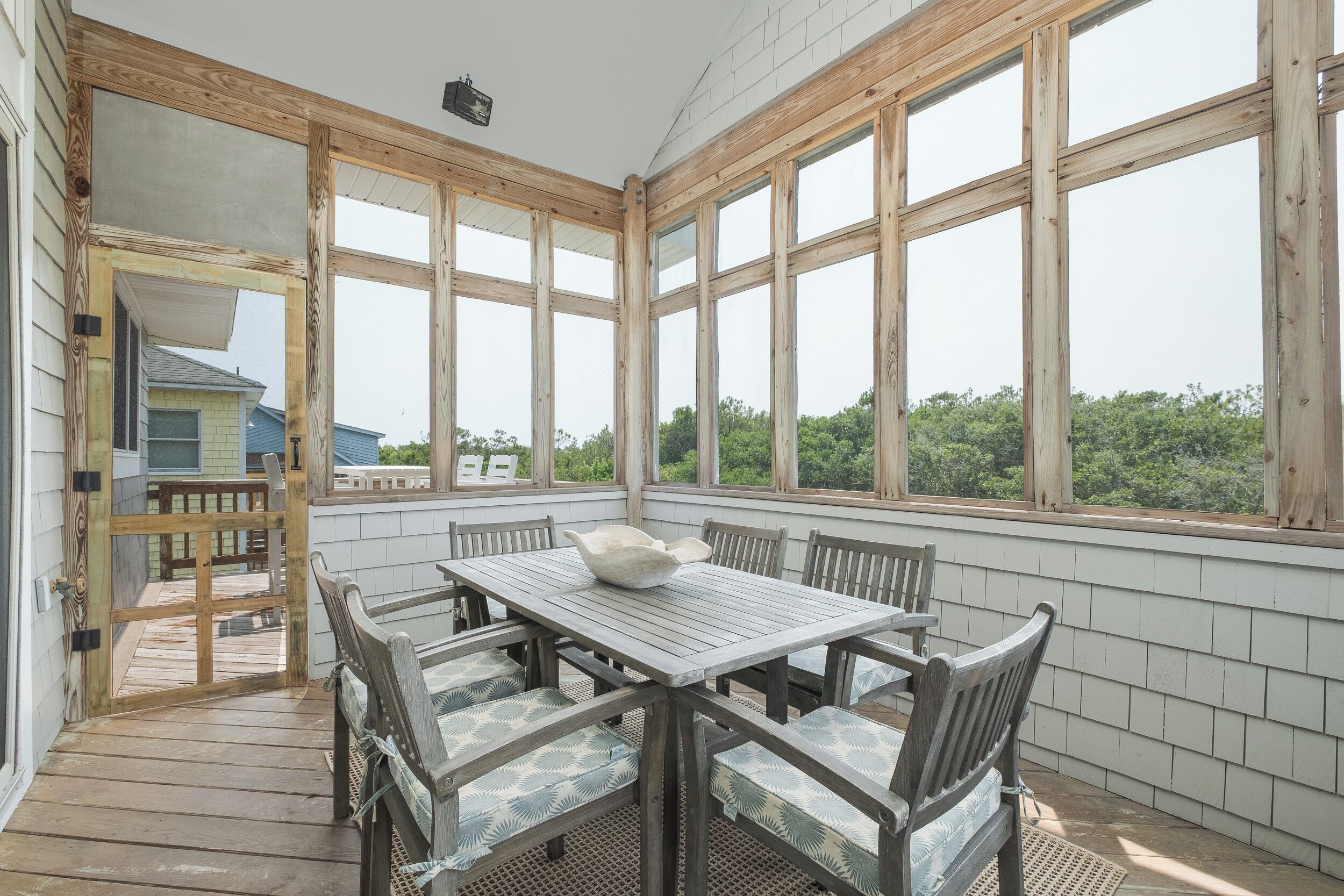 Enjoy meals with a view in the enclosed outdoor dining area