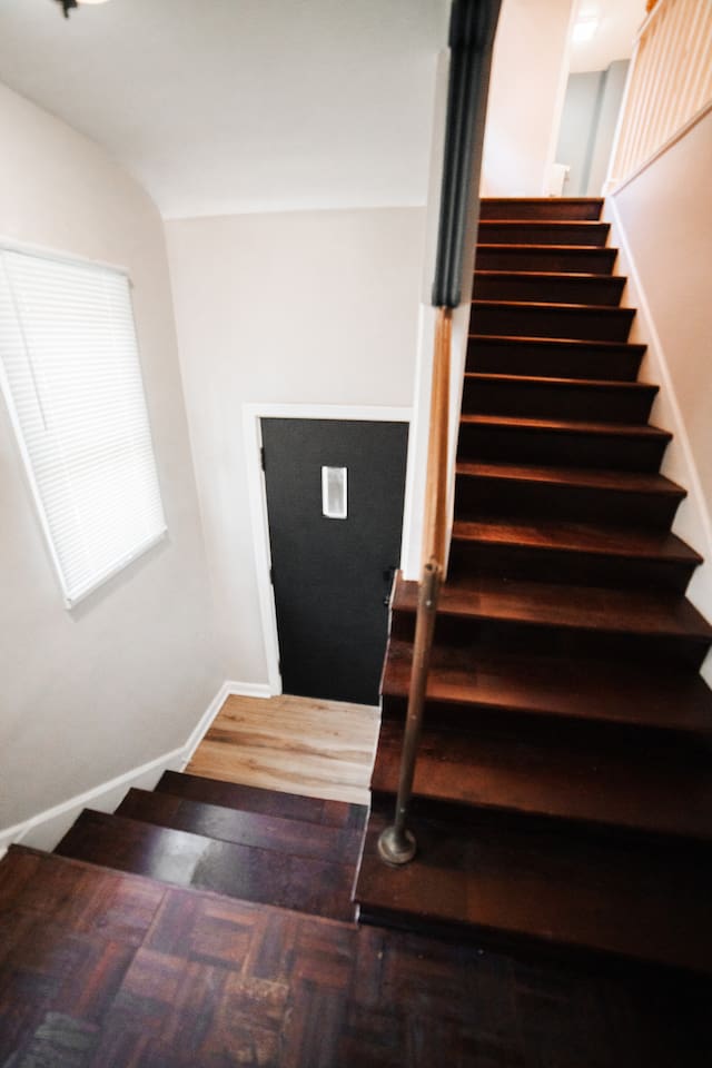 Stairs that lead upstairs to unit.