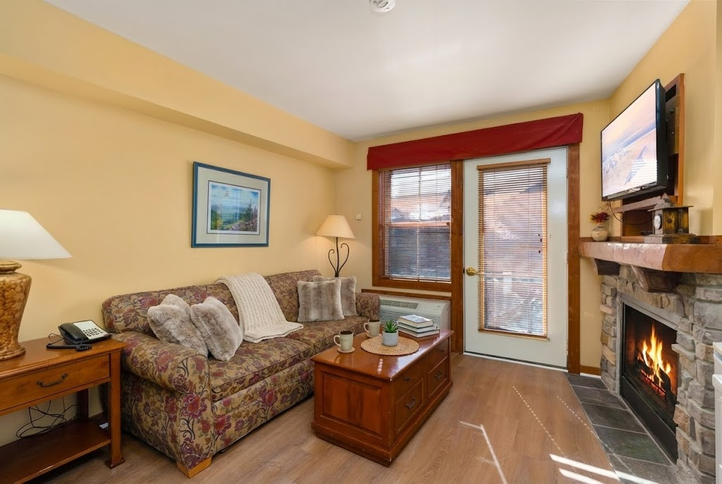 Living area with a smart TV and fireplace, perfect for relaxation!