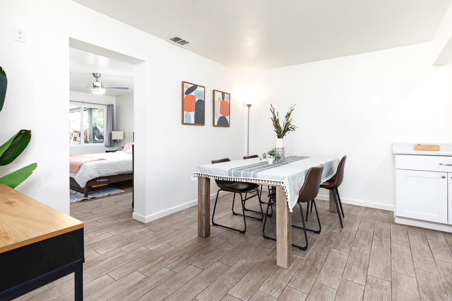 This cozy dining area features clean lines, soft lighting, and a simple modern design perfect for casual meals or morning coffee.

