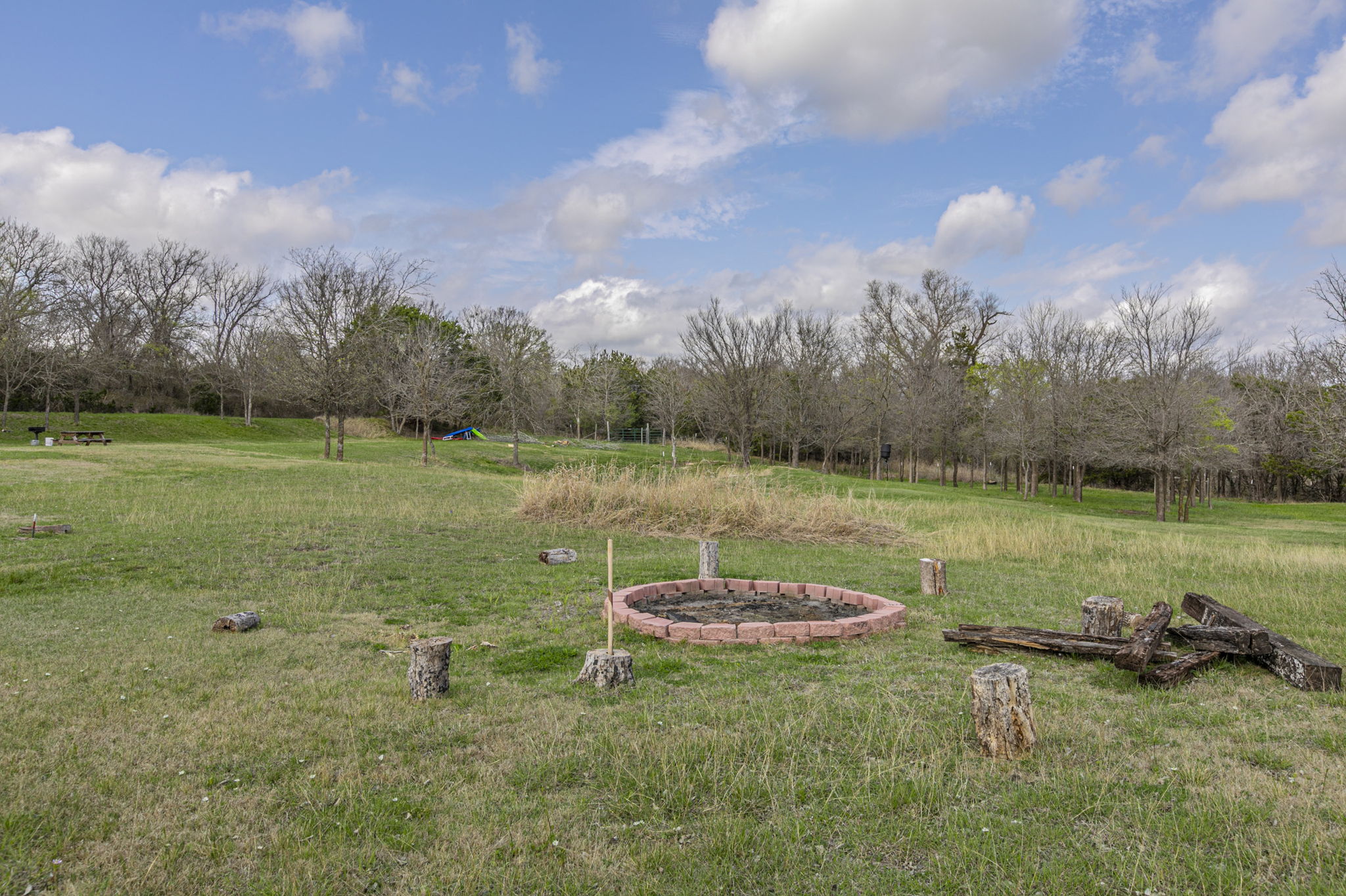 A short car ride down the road leads to a grassy area with river access.