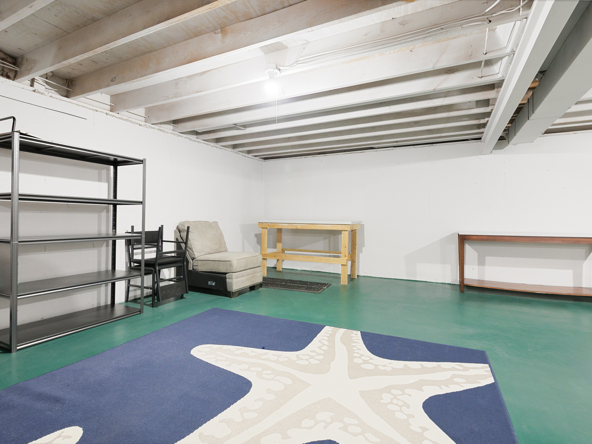 Open basement utility area offering extra space for storage or flexible use.