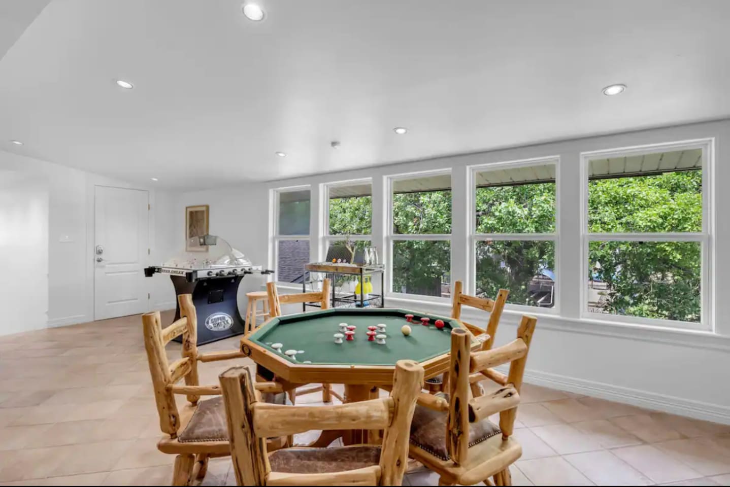 Round poker table that converts to bumper pool and a dining table