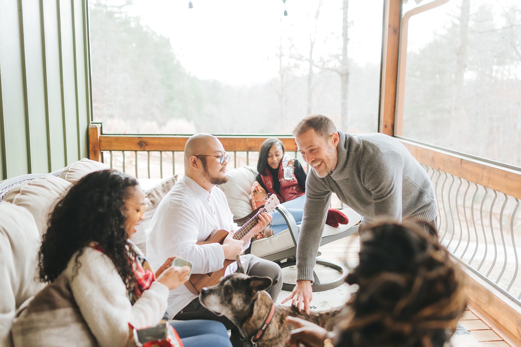 Enjoy the screened in porch. Ceiling fans and blankets make this the perfect spot no matter the weather.