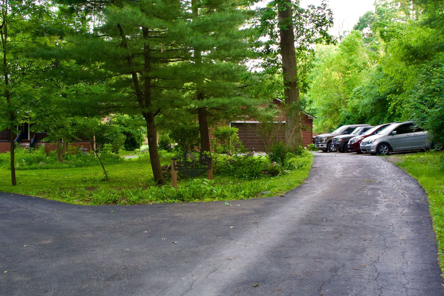 There are approximately 5 parking spaces off the edge of the driveway as shown. One additional car (not pictures) can park parallel to the driveway.
