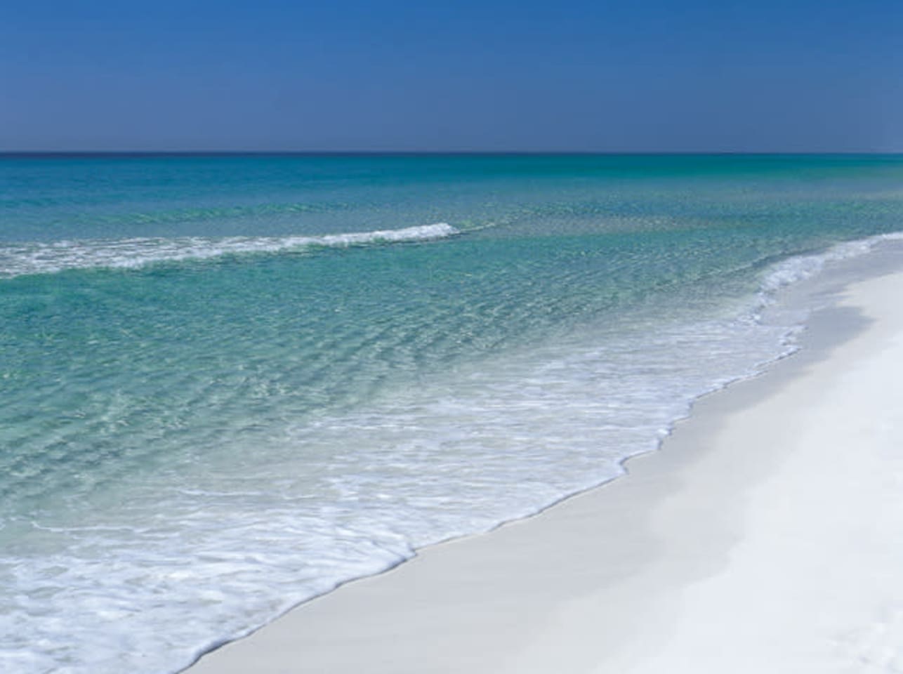 Clear, turquoise warm water and soft, white sand at Rosemary Beach and along 30A.  